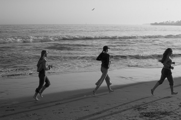 girls running on the beach