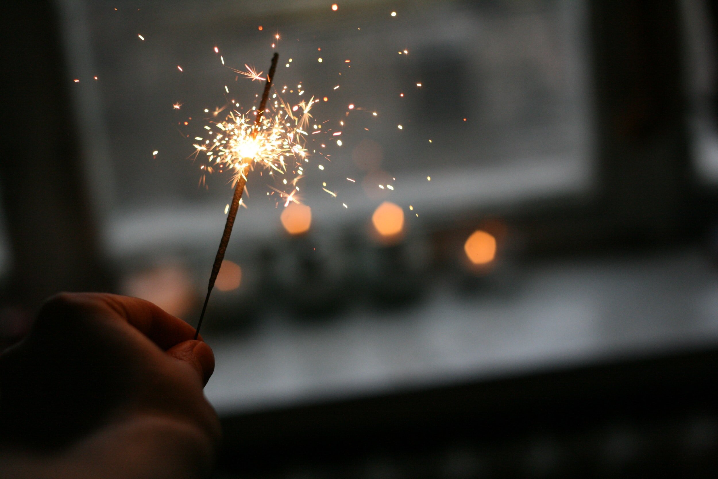 Sparkler igniting a bright burst of sparks, symbolizing a vibrant start to the new year and daily productivity