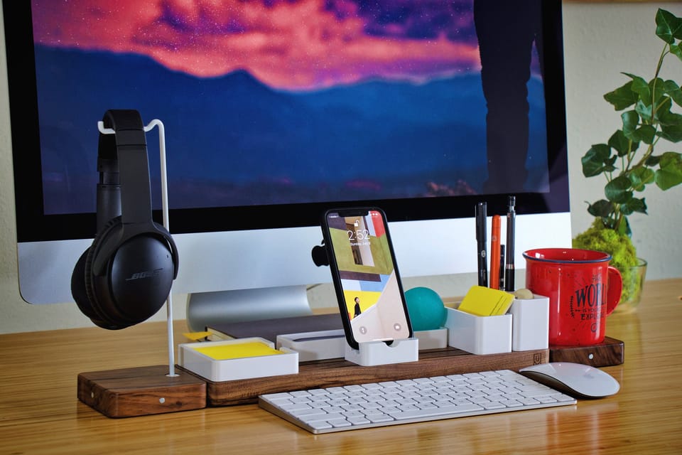 Organized desk with tech gadgets, embodying structured AI-driven productivity in a modern workspace.